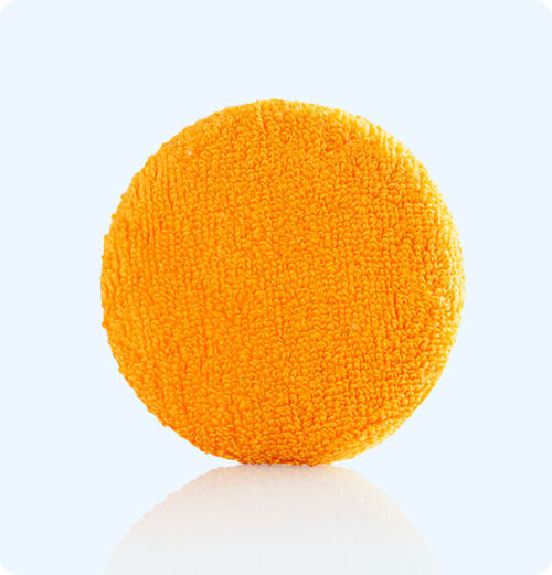Almohadilla naranja Vibro Sculpt para potenciar la absorción de aceites